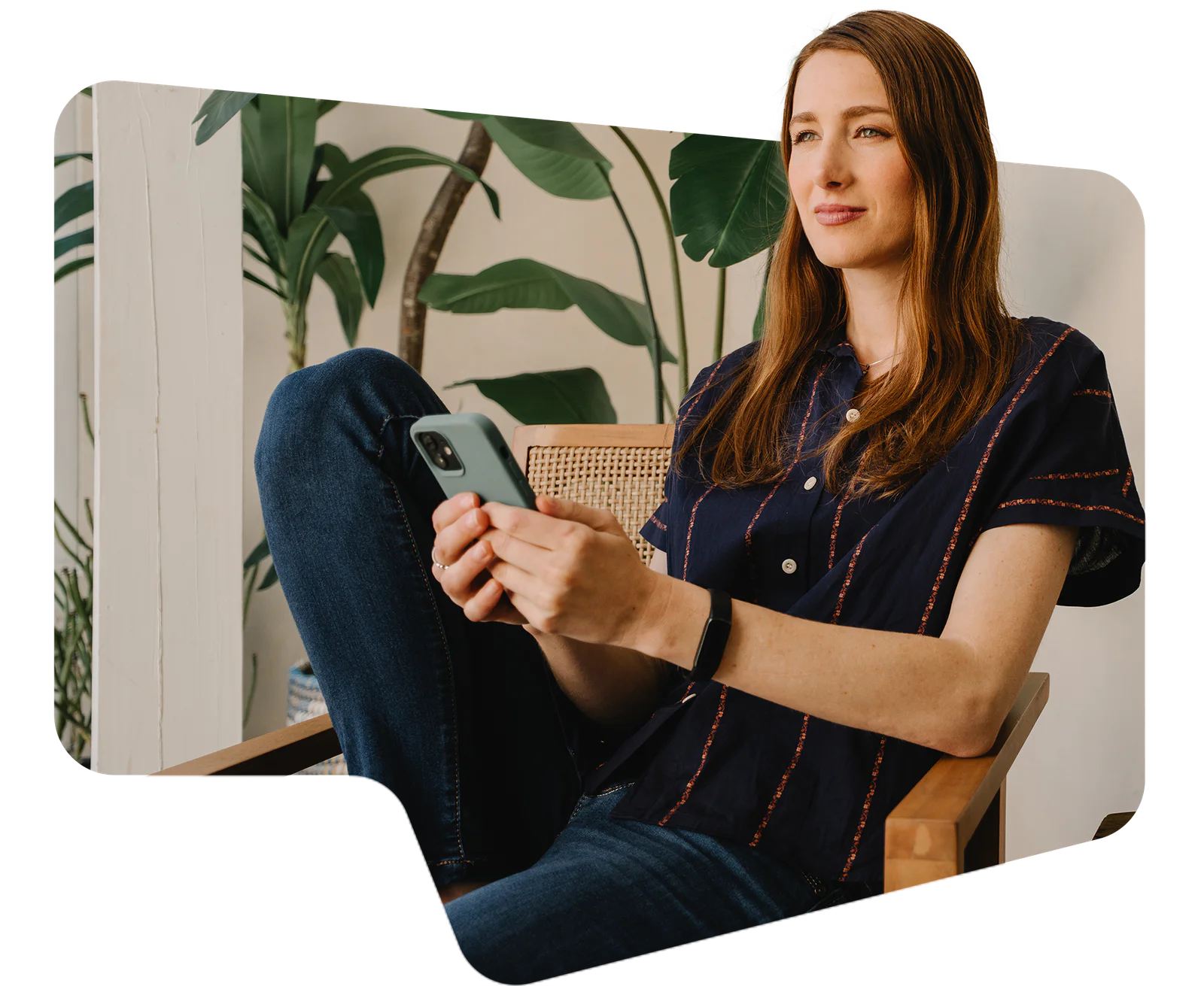 2025 state of customer engagement report Woman sitting on patio with a phone, next to a laptop and plants