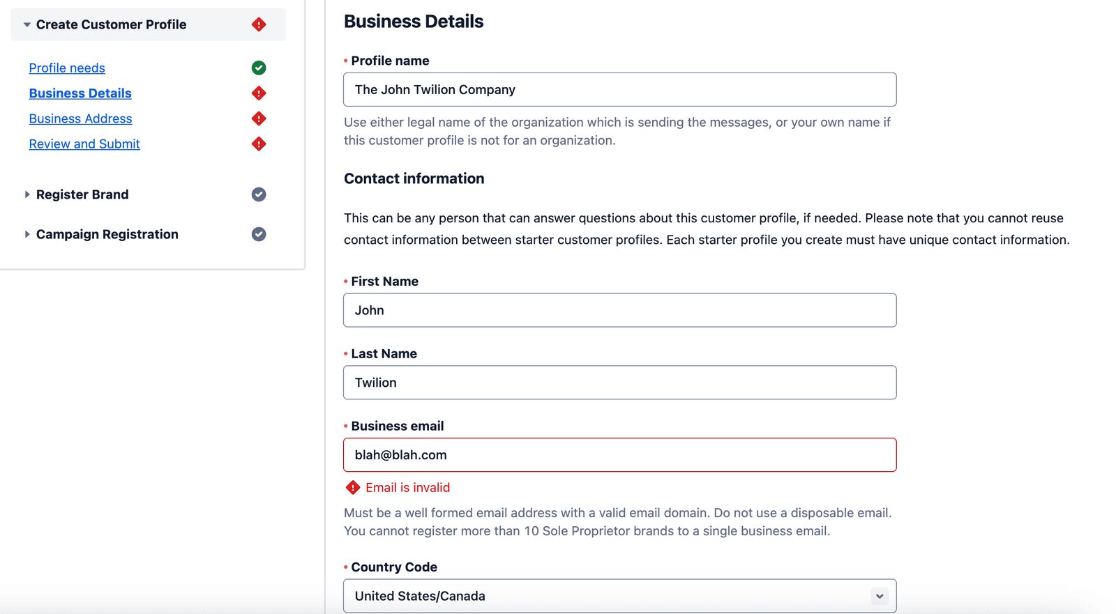 Business profile form with invalid email error highlighted.