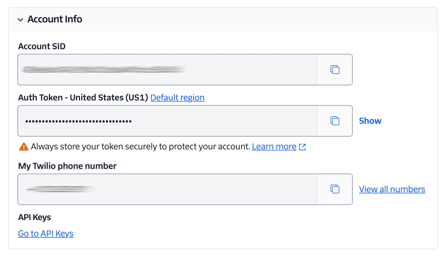 A screenshot showing Twilio account information including Account SID, Auth Token, phone number, and API keys. A screenshot showing Twilio account information including Account SID, Auth Token, phone number, and API keys.
