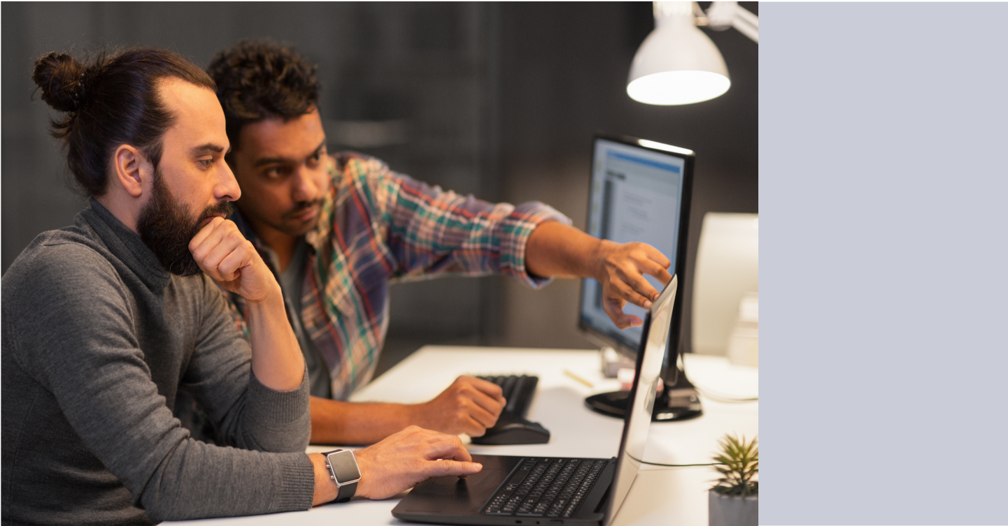 Coworkers building a messaging API PoC on a laptop