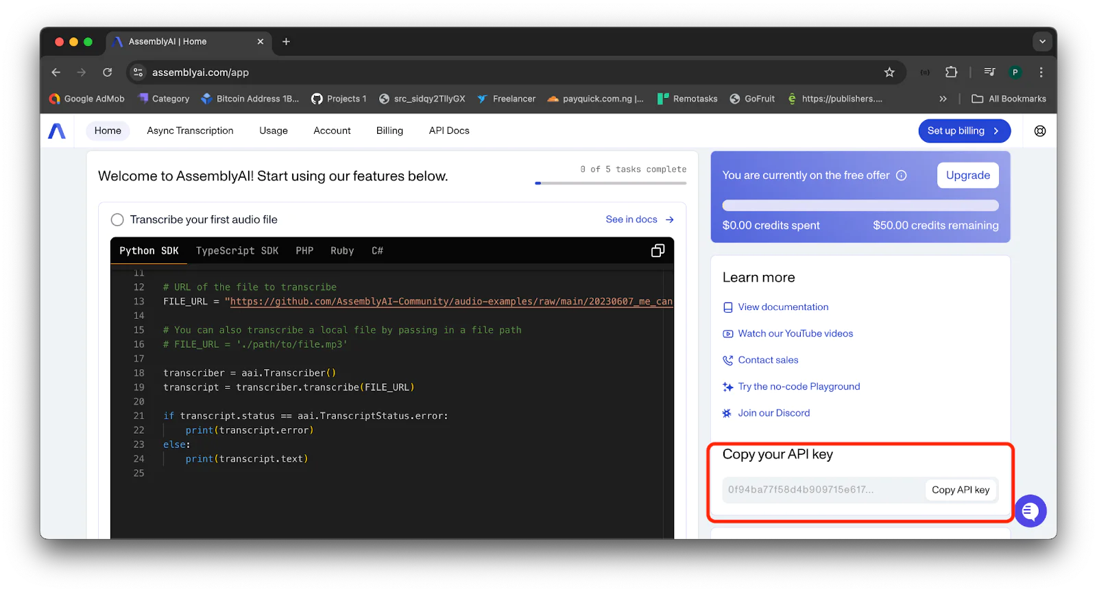 Screenshot of AssemblyAI website showing Python code and an API key highlighted in red at the bottom right. Screenshot of AssemblyAI website showing Python code and an API key highlighted in red at the bottom right.