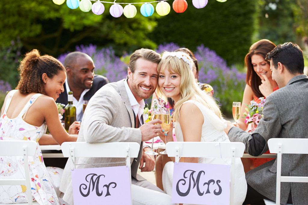 http://www.dreamstime.com/stock-photos-bride-groom-enjoying-meal-wedding-reception-looking-to-camera-smiling-image35609923