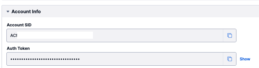 Twilio console showing Account SID and Auth Token (masked)