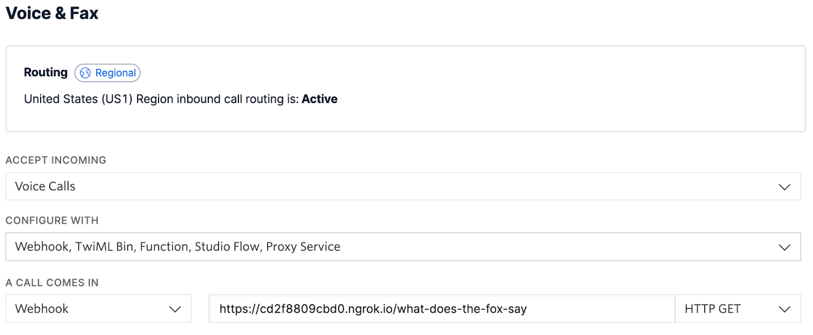 Voice & Fax section in the Twilio Phone Number configuration page. Under the "A CALL COMES IN" label, a dropdown is set to "Webhook", the text field next to it is configured with "https://cd2f8809cbd0.ngrok.io/what-does-the-fox-say", and the dropdown next to that is set to "HTTP GET".