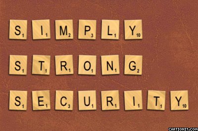 Scrabble tiles spelling Simply Strong Security on a brown leather-like background.