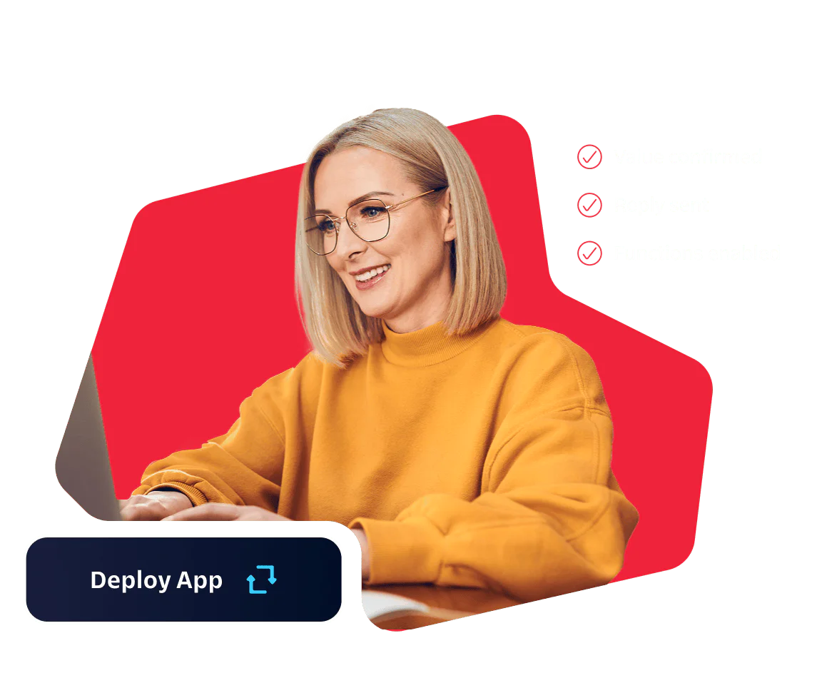 Woman in Yellow Sweater Using Laptop with Deployment Confirmation Woman in yellow sweater using a laptop with a Deploy App button and confirmed deployment status