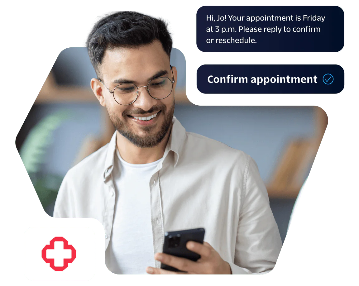 Human-centered health experiences at scale with Twilio’s proven platform for omnichannel engagement. Man with glasses smiling at phone, confirming an appointment, medical cross icon visible.